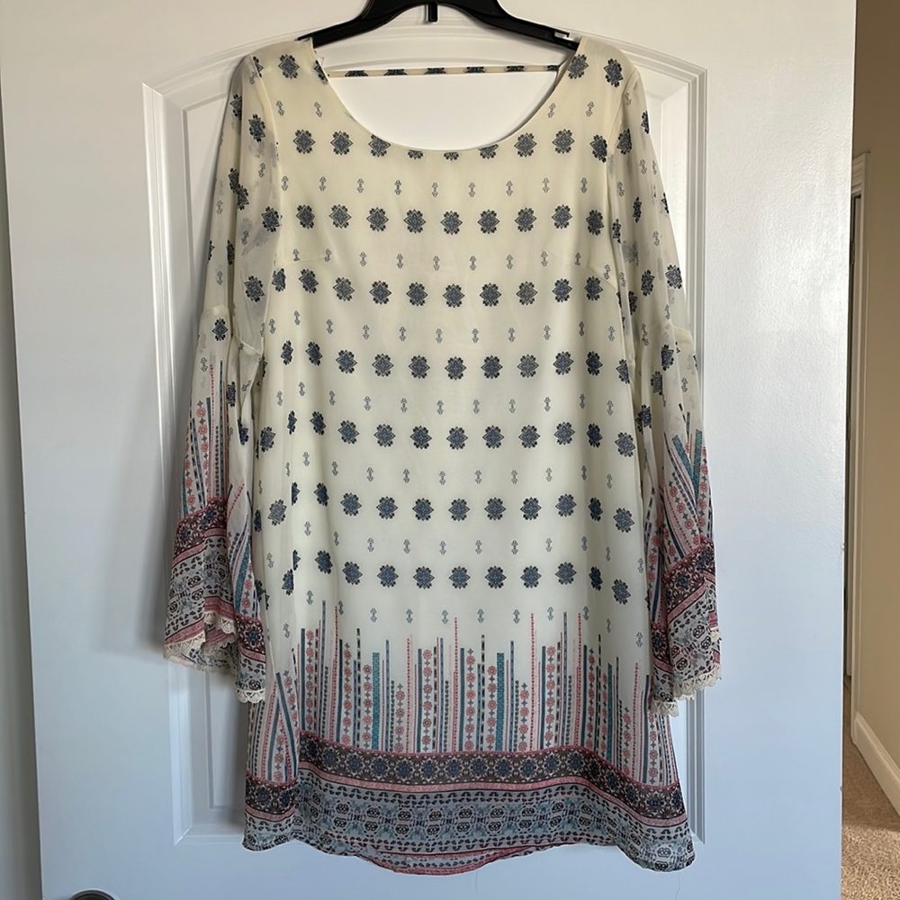 White midi dress with colorful design along with bell sleeves, size medium
